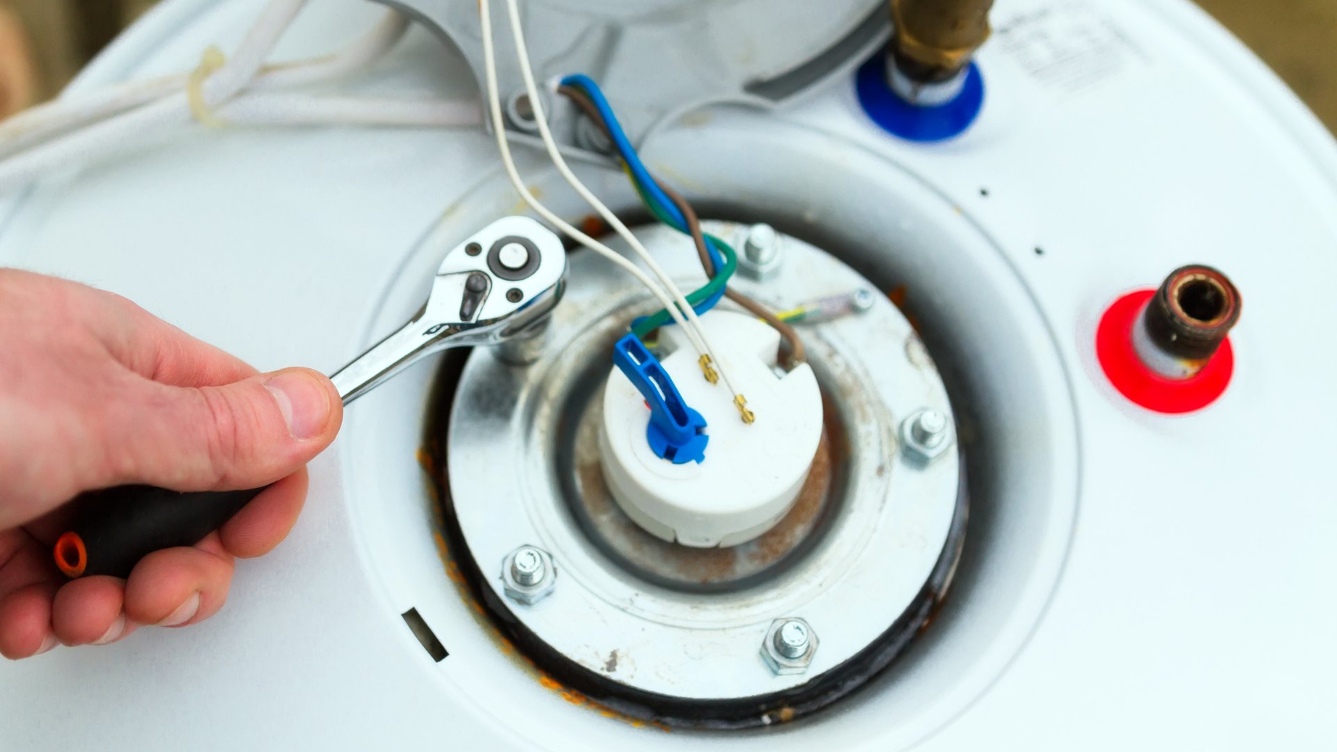 plumber-repairing-water-heater-tank-with-tool-baldwin-pa